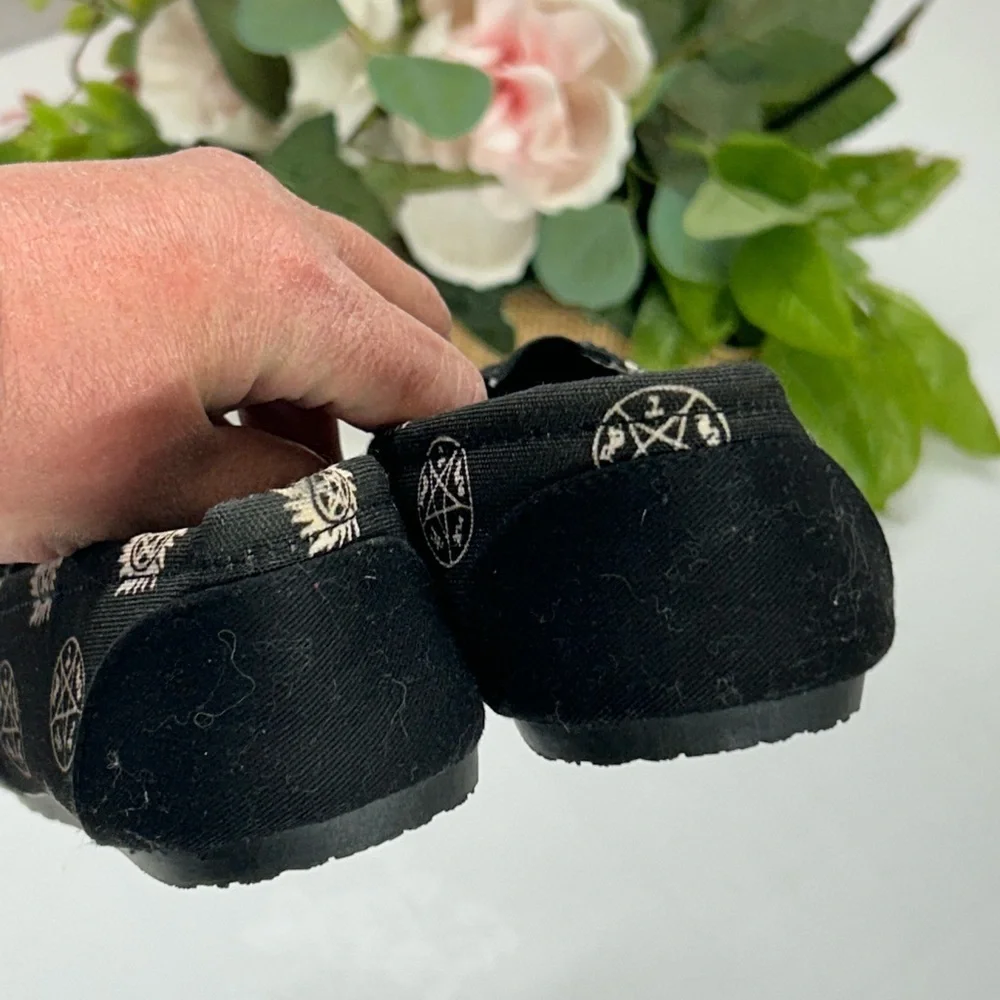 Black Slip-On Shoes with Supernatural Print